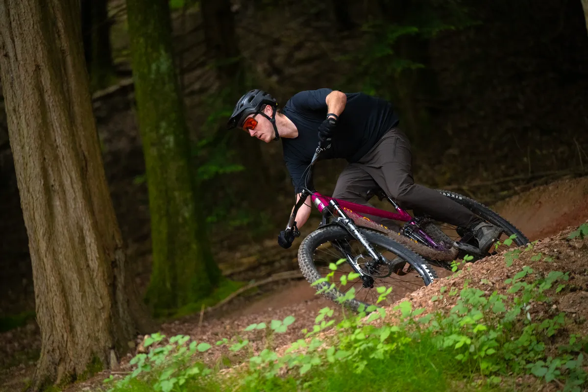 Tom Law riding Marin mountain bike down trail in Forest of Dean.
