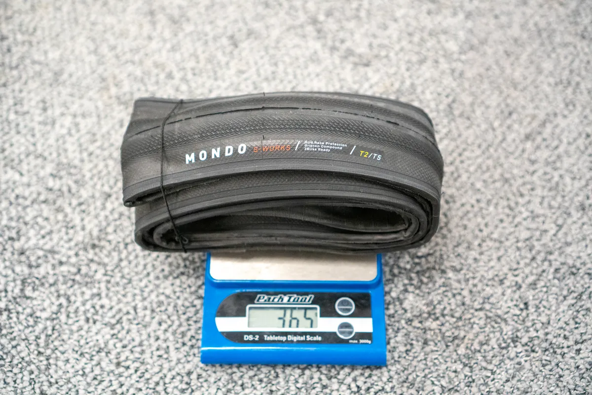 Specialized S-Works Mondo tyre on scales with weight showing 365g.