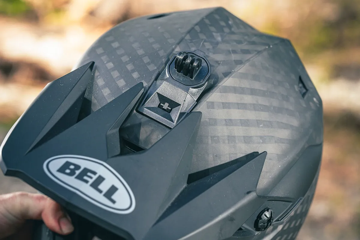 A snap-on camera mount fits securely into the top of the helmet