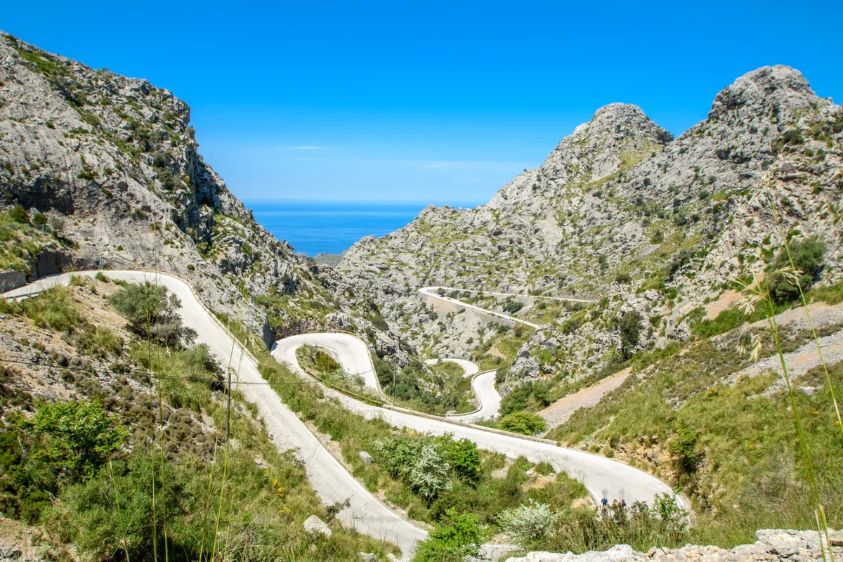 The famous serpentine road to Sa Colabra beach in Mallorca