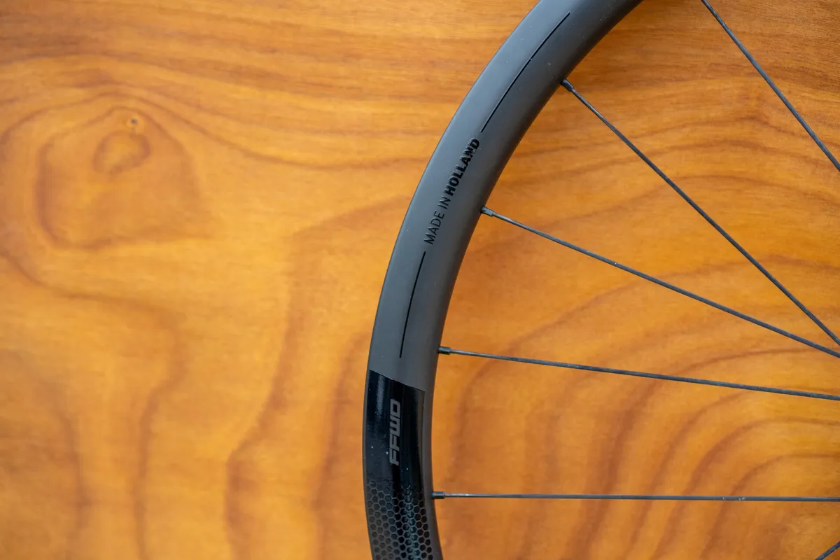 FFWD RYOT 33 wheels against a wooden background