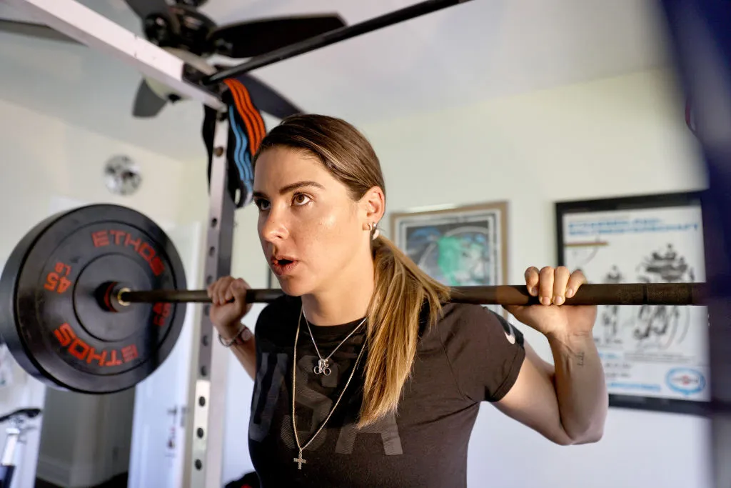 ALLENTOWN, PENNSYLVANIA - JUNE 09: Olympic hopeful cyclist Mandy Marquardt lifts weights and trains in her home on June 09, 2020 in Allentown, Pennsylvania. Athletes across the globe are now training in isolation under strict policies in place due to the Covid-19 pandemic. (Photo by Elsa/Getty Images)