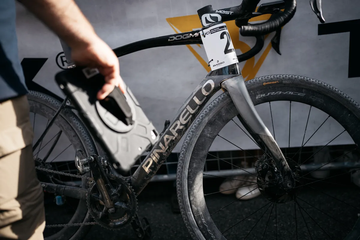 A number plate is about as un-aero as it gets, so many riders resorted to wrapping theirs around the headtube.