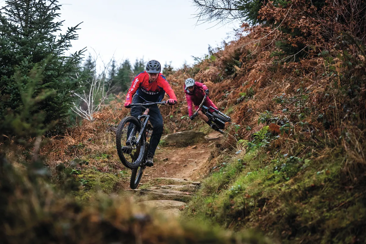 Riders descending on dirt trail at Cwmcarn