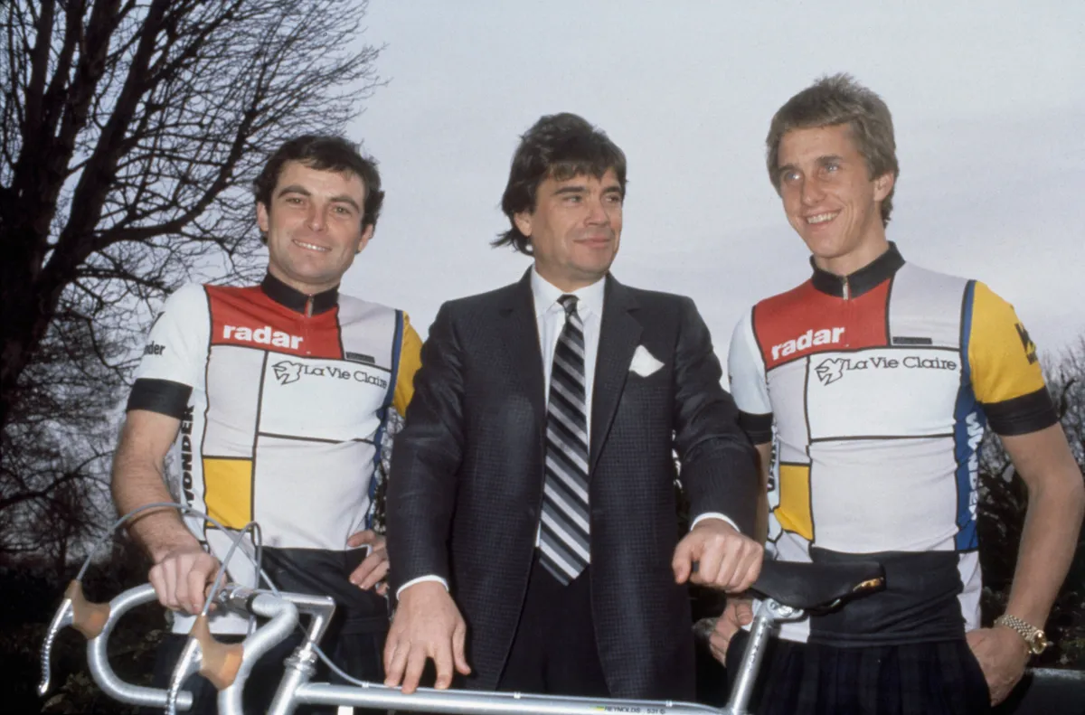 Old photograph showing Bernard Hinault, Bernard Tapie and Greg LeMond in line.