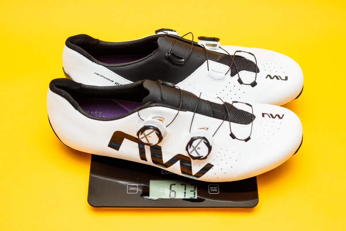 Northwave Veloce Extreme cycling shoes white on scales showing weight of 673g.