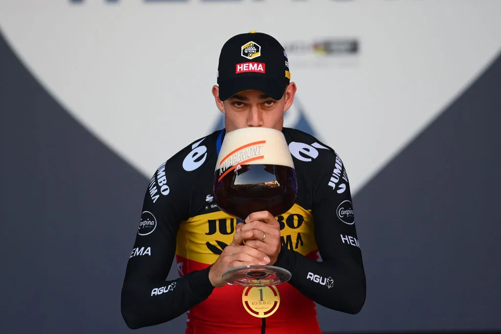 Wout Van Aert of Belgium and Team Jumbo-Visma celebrates with a beer as race winner after the 65th E3 Saxo Bank Classic 2022