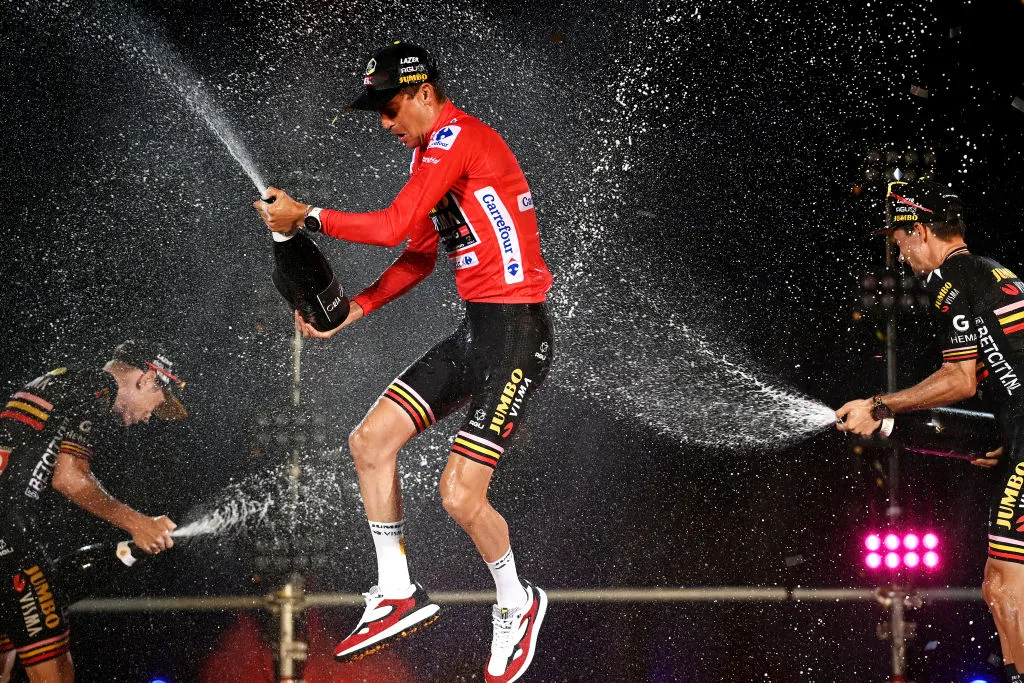Jonas Vingegaard, race winner Sepp Kuss and Primoz Roglic celebrate with champagne on the podium ceremony after the 78th Vuelta a Espana in 2023