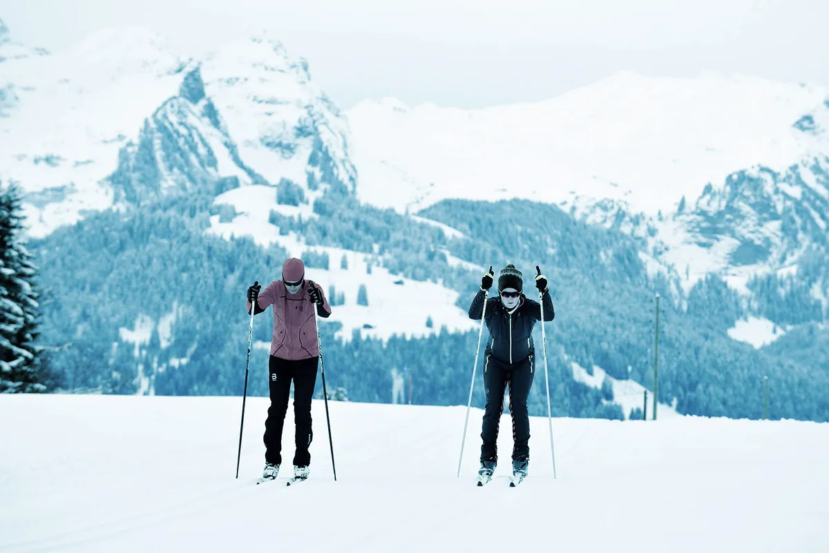Two people skiing