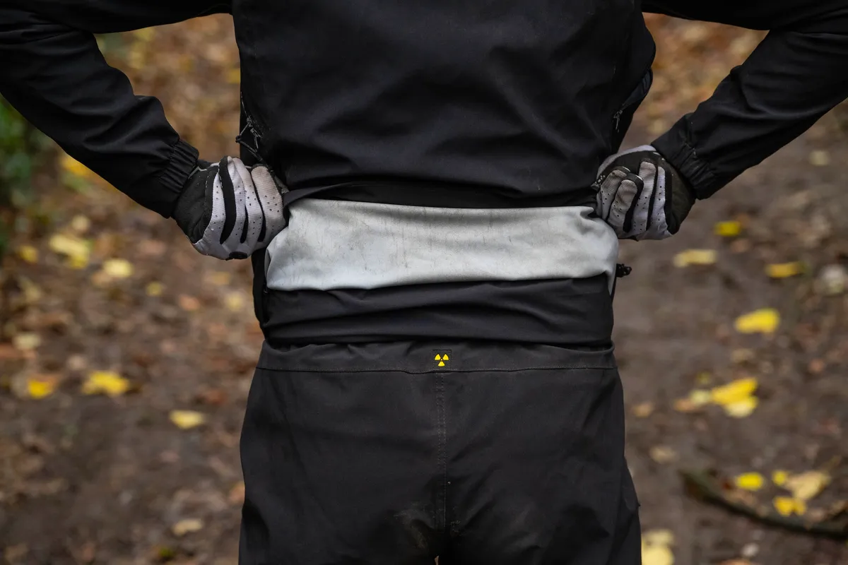 A Nukeproof Blackline Dirt Suit connected together.