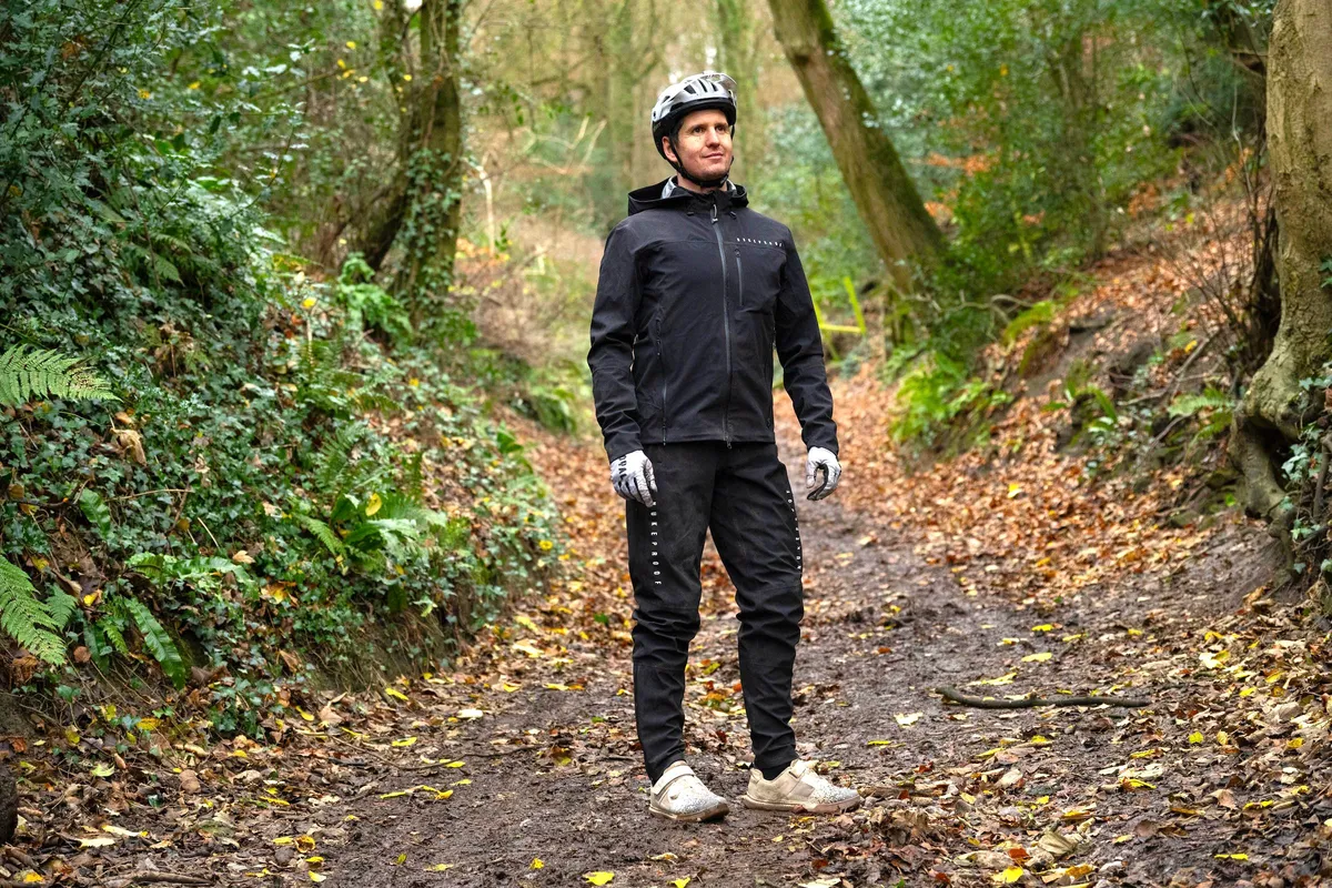 Wearing a Nukeproof Blackline Dirt Suit in the woods.