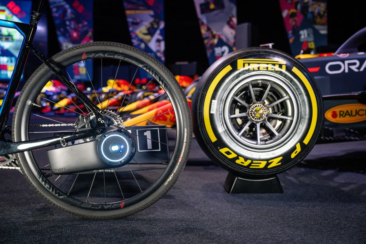 Skarper ebike unit wheel-to-wheel with Formula One car