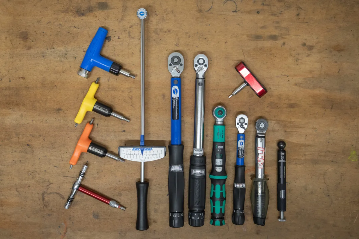 A collection of torque wrenches on a workbench