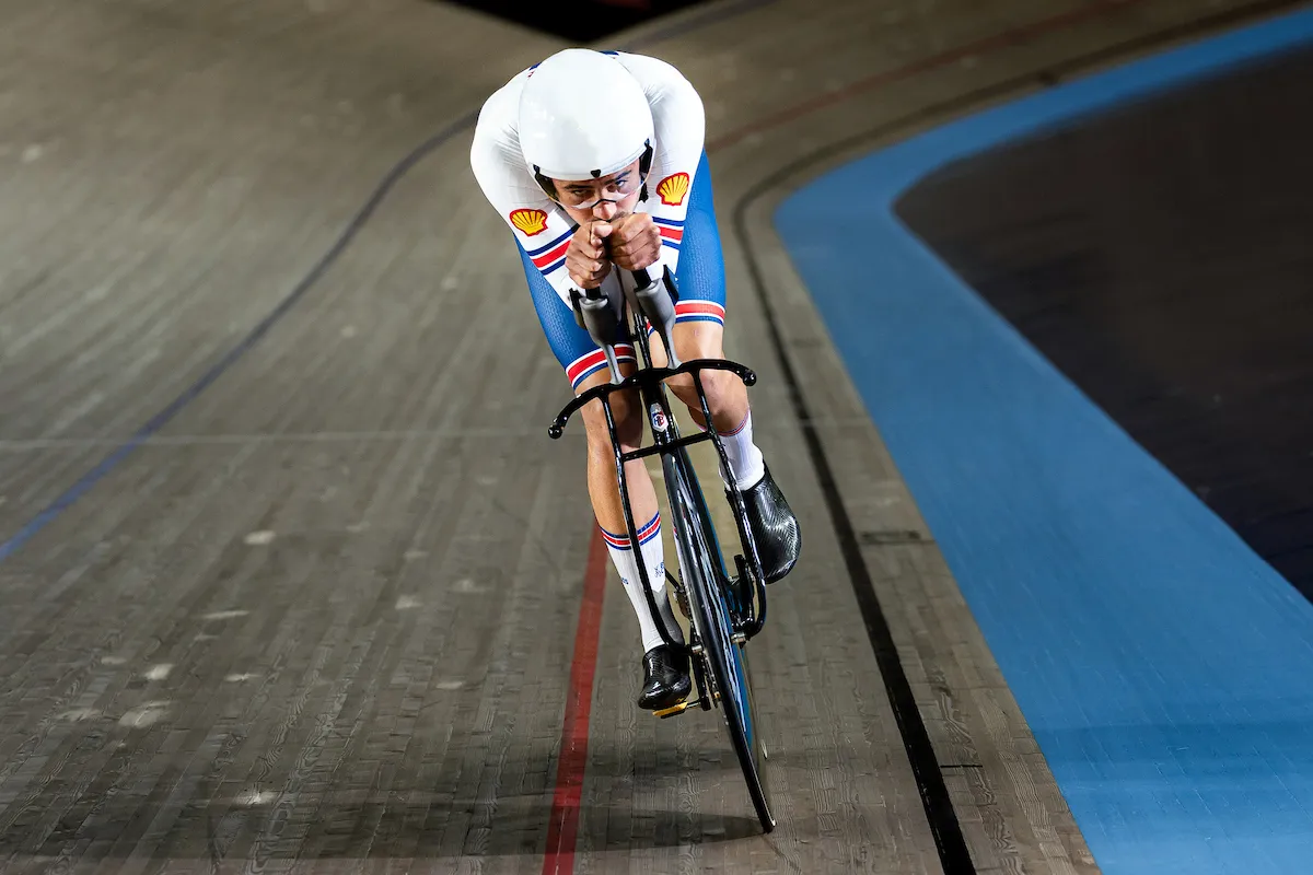 Hope-Lotus track bike being ridden by British Cycling's Charlie Tanfield on a velodrome track