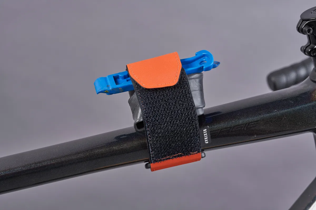Restrap Frame strap holding inner tube and tyre levers on bike