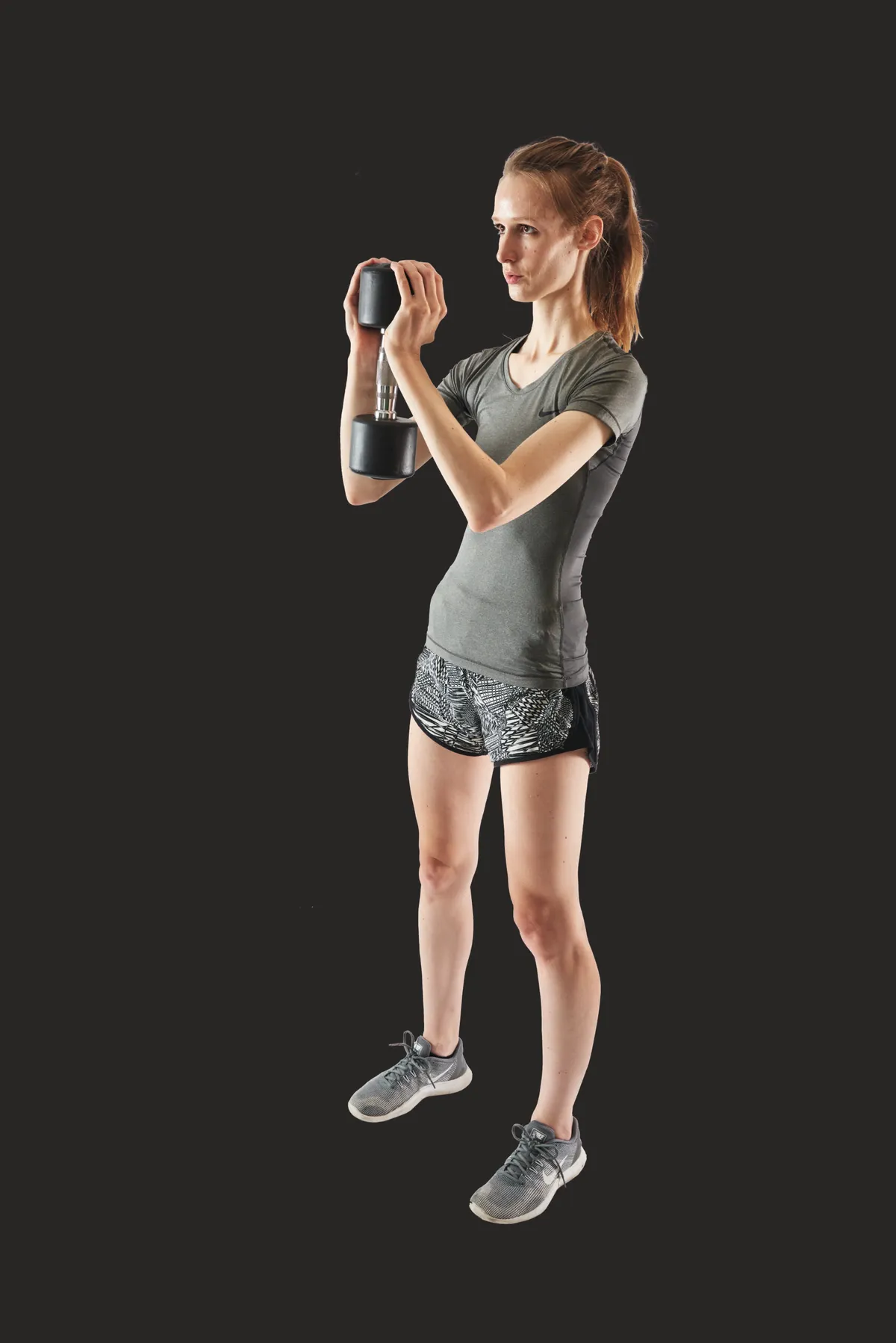 woman showing top stage of goblet squat