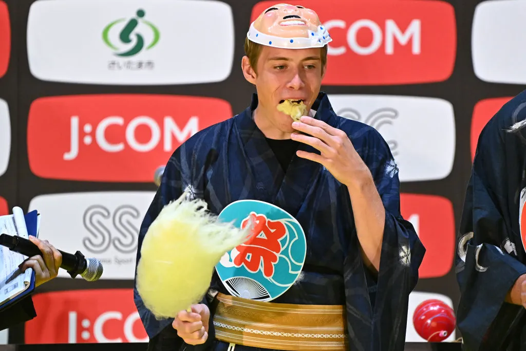 SAITAMA, JAPAN - NOVEMBER 05: Jonas Vingegaard Rasmussen of Denmark and Team Jumbo - Visma Yellow Leader Jersey makes cotton candy and participates in a Quiz Contest at Thematic Japanese Festival during the 8th Tour de France Saitama Criterium 2022 - Media Day / #SaitamaCriterium / on November 05, 2022 in Saitama, Japan. (Photo by Kenta Harada/Getty Images)