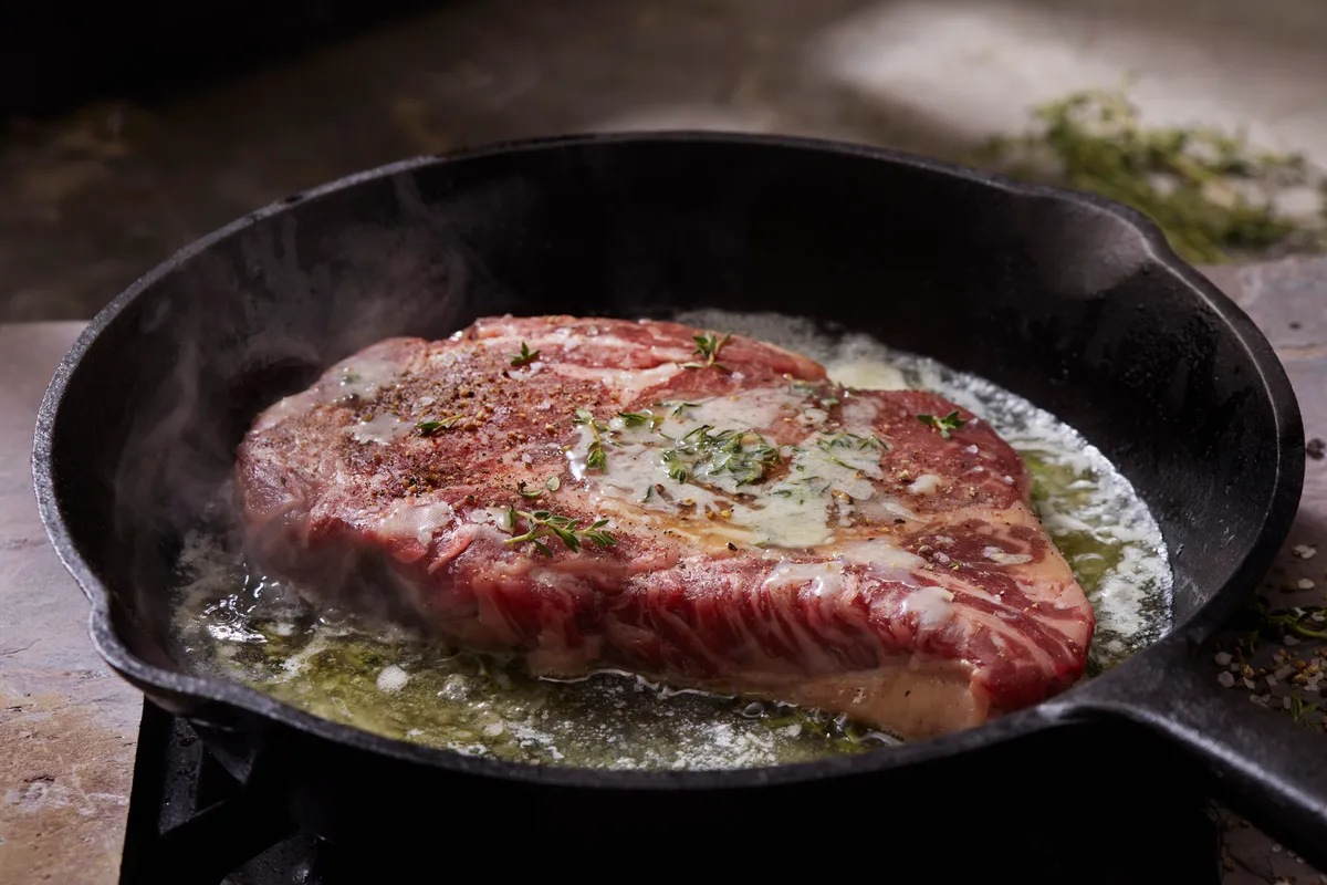 Pan Searing Beef Eye Rib Steak with Garlic, Butter and Thyme.