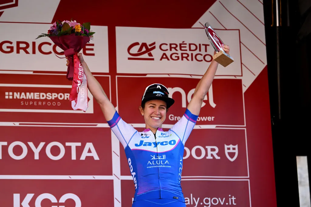 SIENA, ITALY - MARCH 04: Kristen Faulkner of The United States and Team Jayco-Alula celebrates at podium as third place during the Eroica - 9th Strade Bianche 2023, Women's a 136km one day race from Siena to Siena 318m / #StradeBianche / on March 04, 2023 in Siena, Italy. (Photo by Luc Claessen/Getty Images)