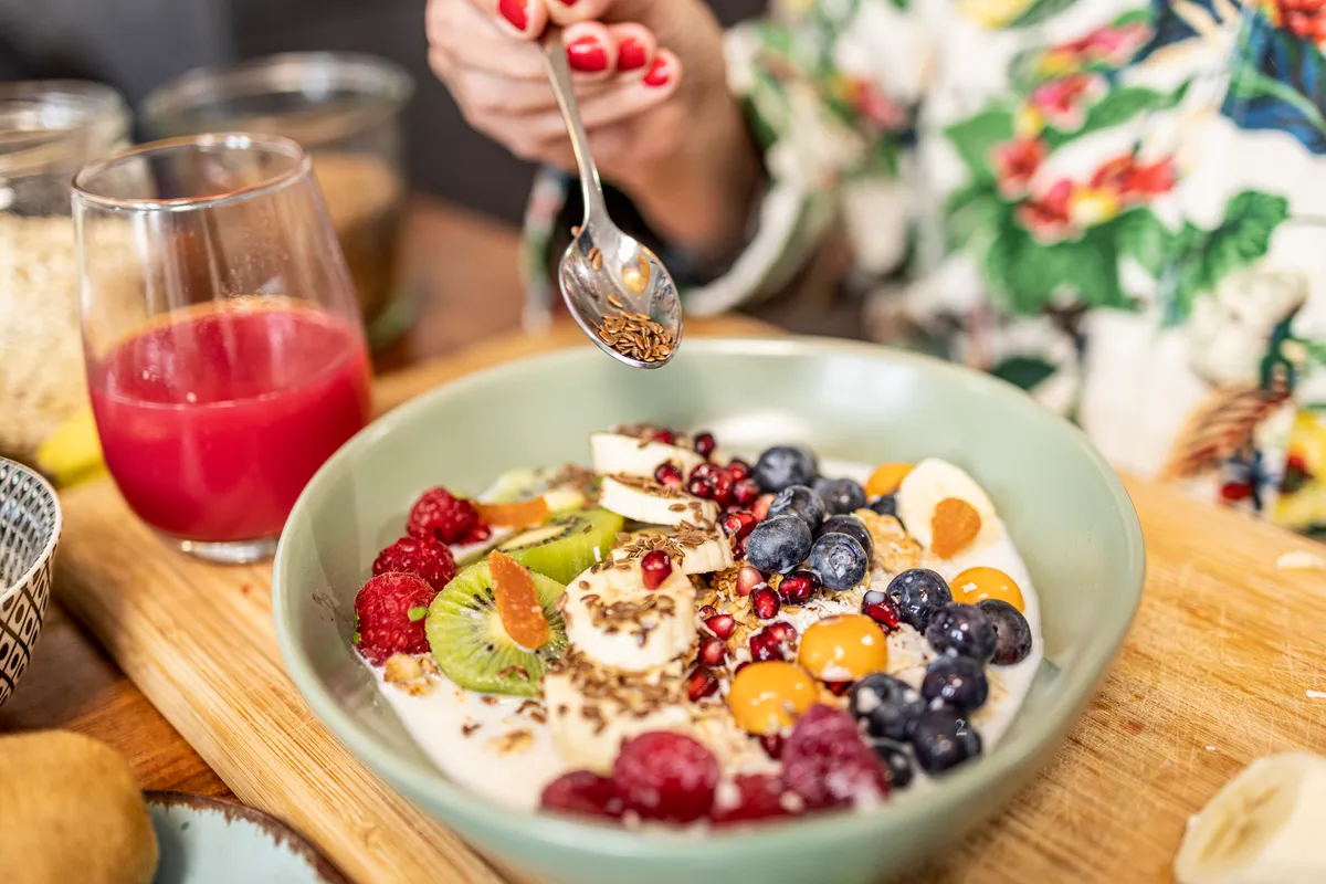 close up of healthy breakfast - superfood bowl with yogurt and fruits