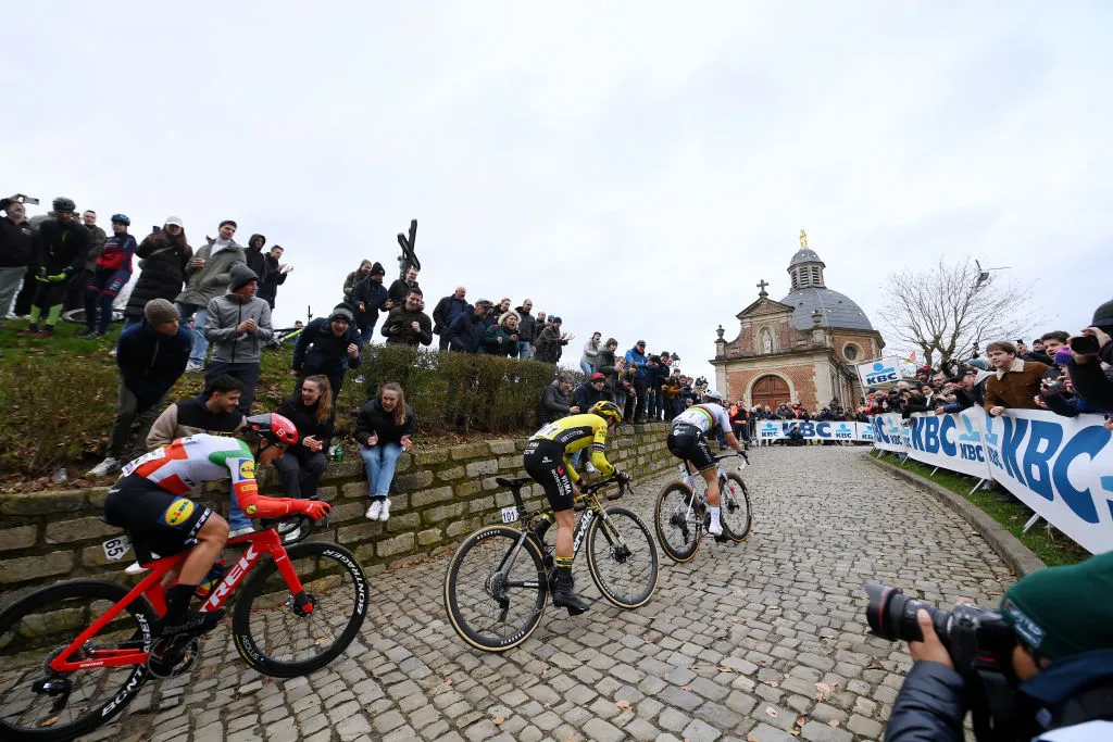 NINOVE, BELGIUM - FEBRUARY 24: (L-R) Elisa Longo Borghini of Italy and Team Lidl-Trek, Marianne Vos of The Netherlands and Team Visma | Lease A Bike and Lotte Kopecky of Belgium and Team SD Worx-Protime compete in the breakaway climbing the Muur van Geraardsbergen while fans cheer during the 16th Omloop Het Nieuwsblad 2024, Women's Elite a 127.1km one day race from Ghent to Ninove / #UCIWWT / on February 24, 2024 in Ninove, Belgium. (Photo by Alex Broadway/Getty Images)