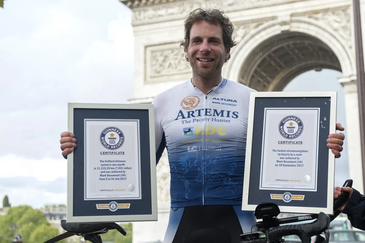 PARIS, FRANCE - SEPTEMBER 18: Mark Beaumont poses with his Guinness World Records after he arrived in Paris after completing 79 days round the world on September 18, 2017 in Paris, France. Mark Beaumont has broken the world record for cycling around the world by 44 days.