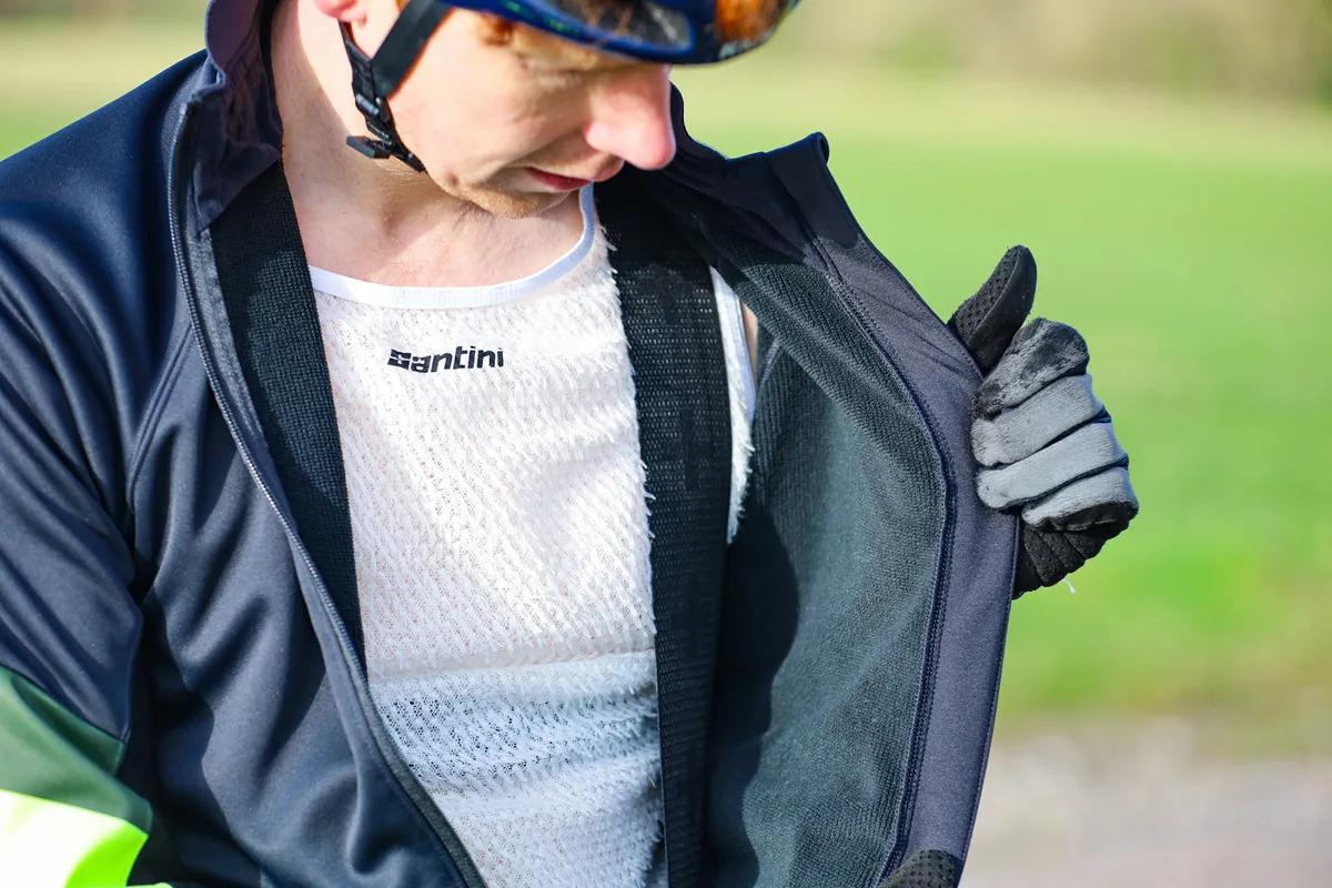 Felix Smith posing in Gore cycling jacket showing fleece lining.
