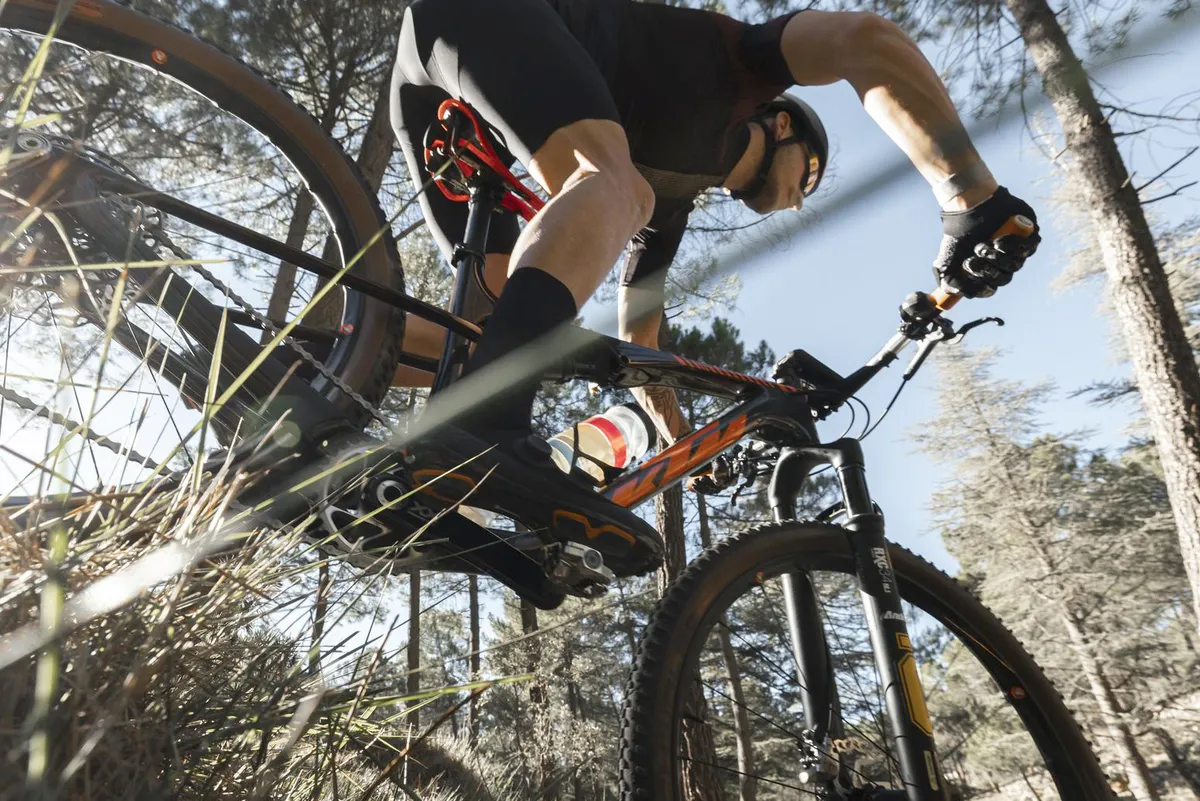 Man riding a mountain bike using Look X-Track Power pedal