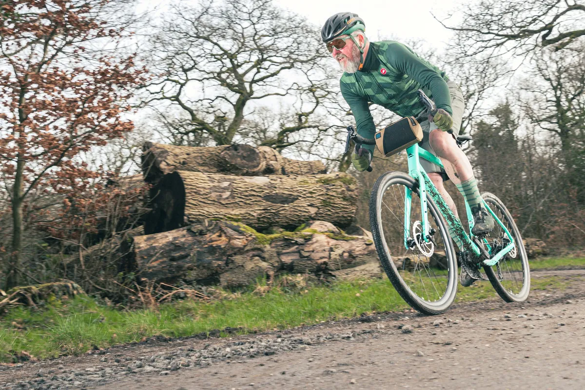 Male cyclist in green top rider the Merida Silex 200 gravel bike