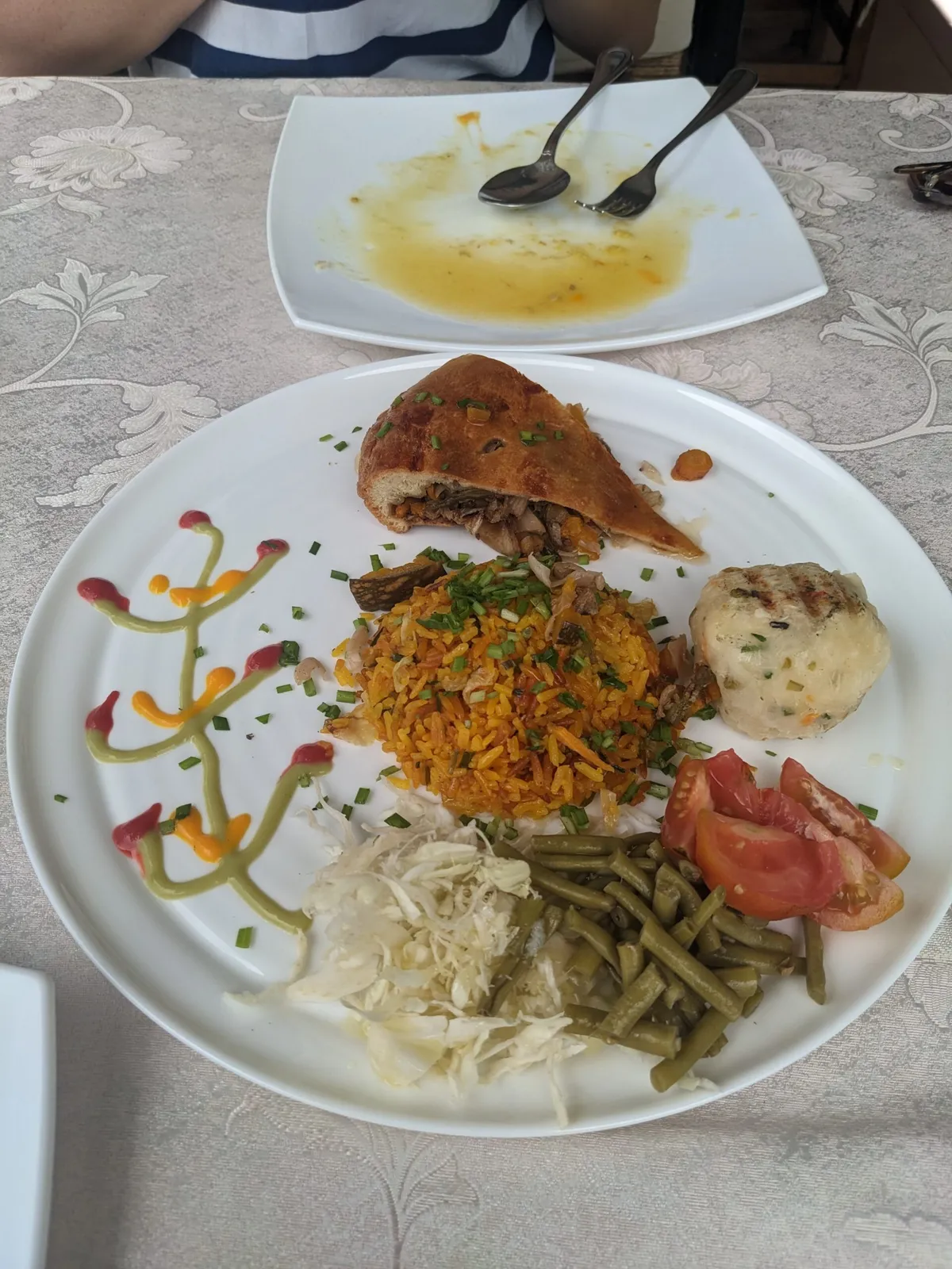 Plate of food with rice, pastry and vegetables from Cuba.