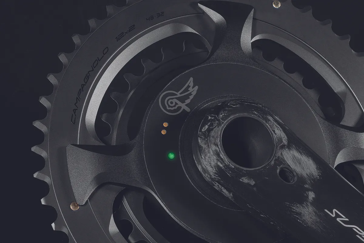 Close up of Campagnolo HPPM crankset showing charging point and LED.