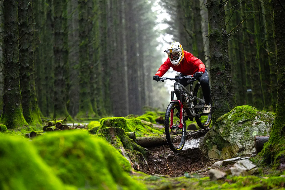 Female mountain biker in red top