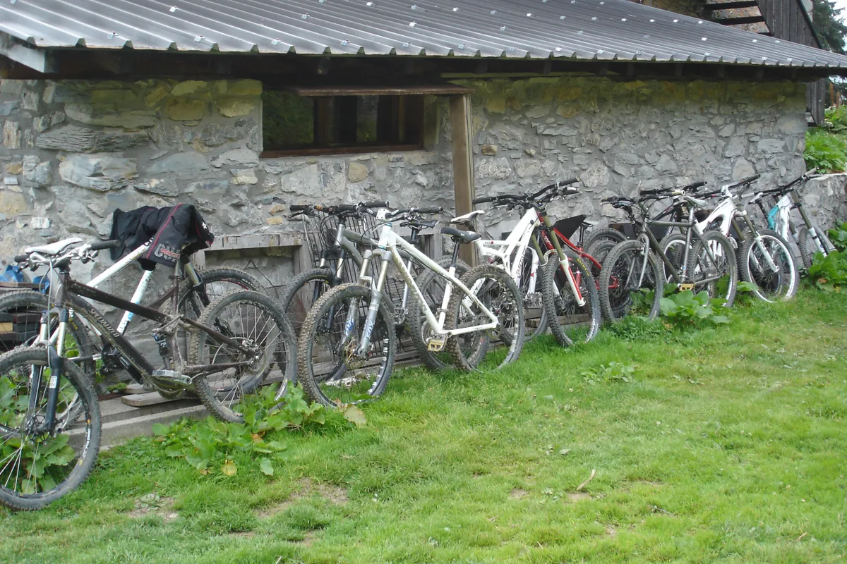 A wide range of different types of mountain bike at a refuge in the French Alps.