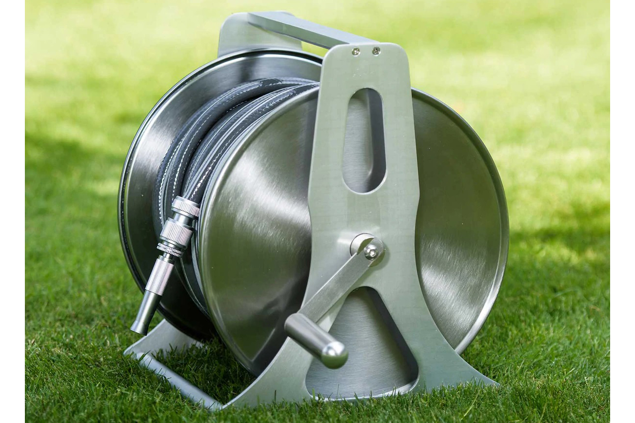 Premium Photo  Garden Hose Reel, Brass Tap and Water Meter. Mobile Garden  hose Connection to Water supply.