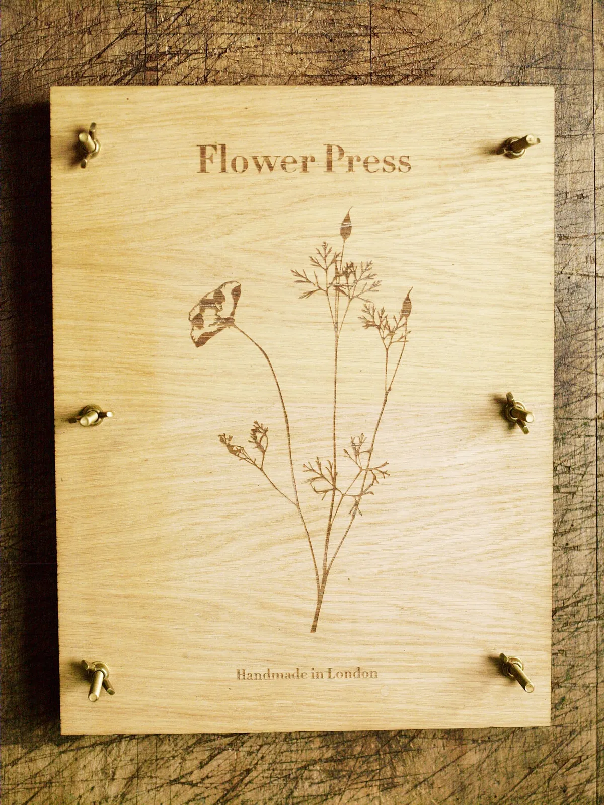 An oak veneer flower press