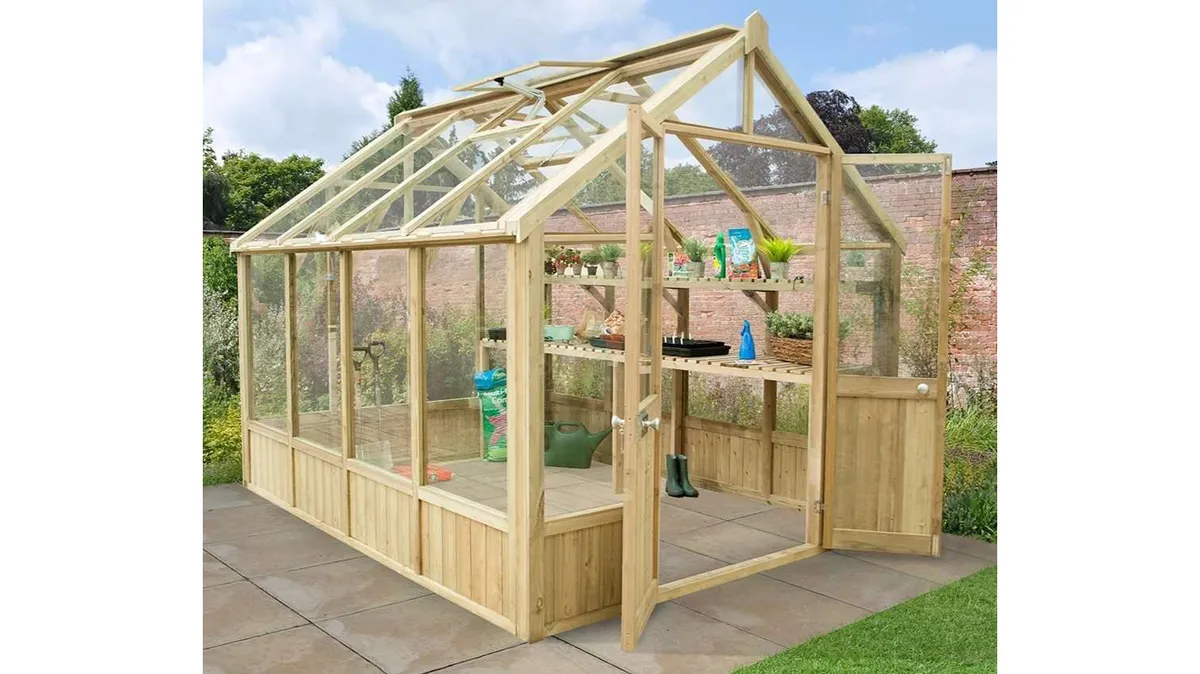 10x8 Vale Victorian Greenhouse by Forest Garden on a patio