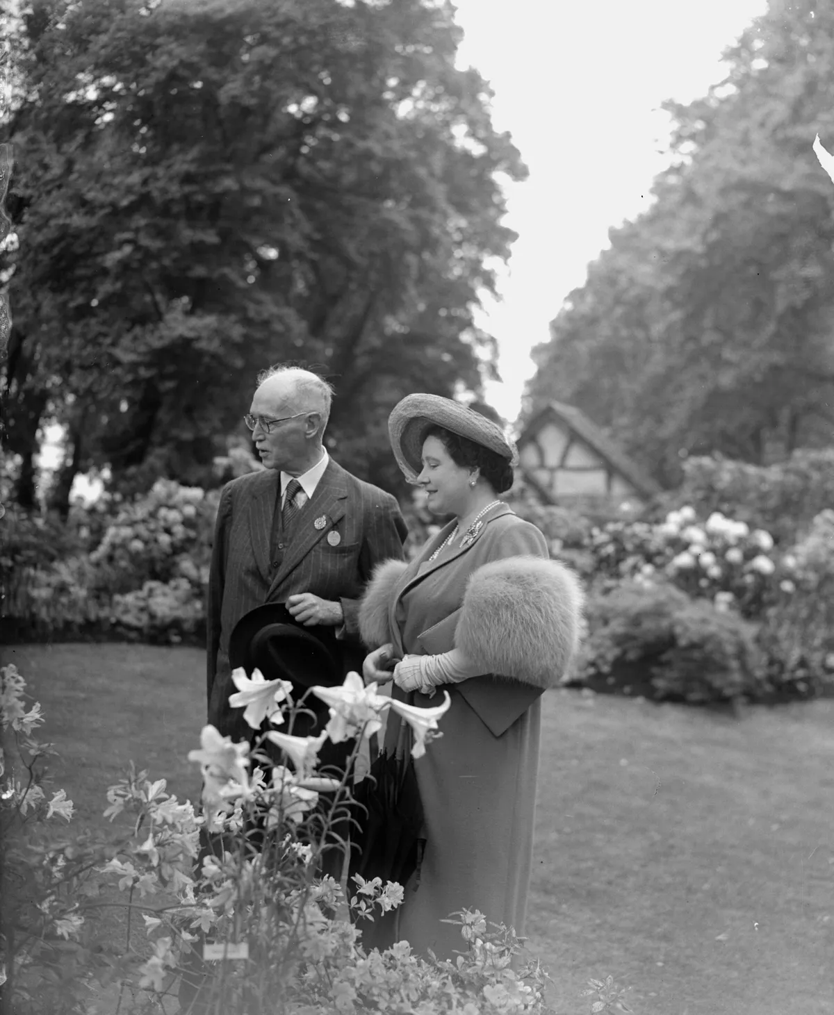 1949: Queen Elizabeth and King George VI talking to a contestant at the Chelsea Flower Show