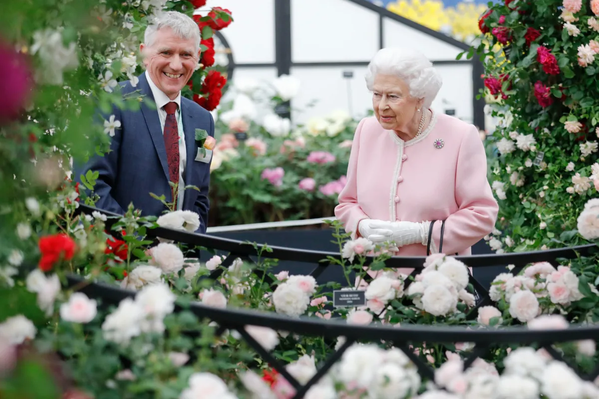 2018: Queen Elizabeth speaks with Ian Limmer on the Peter Beales Roases exhibition as she attends the RHS Chelsea Flower Show