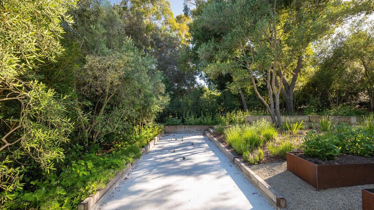 The dry ‘Californian’ zone, with its bocce court at the top of the garden