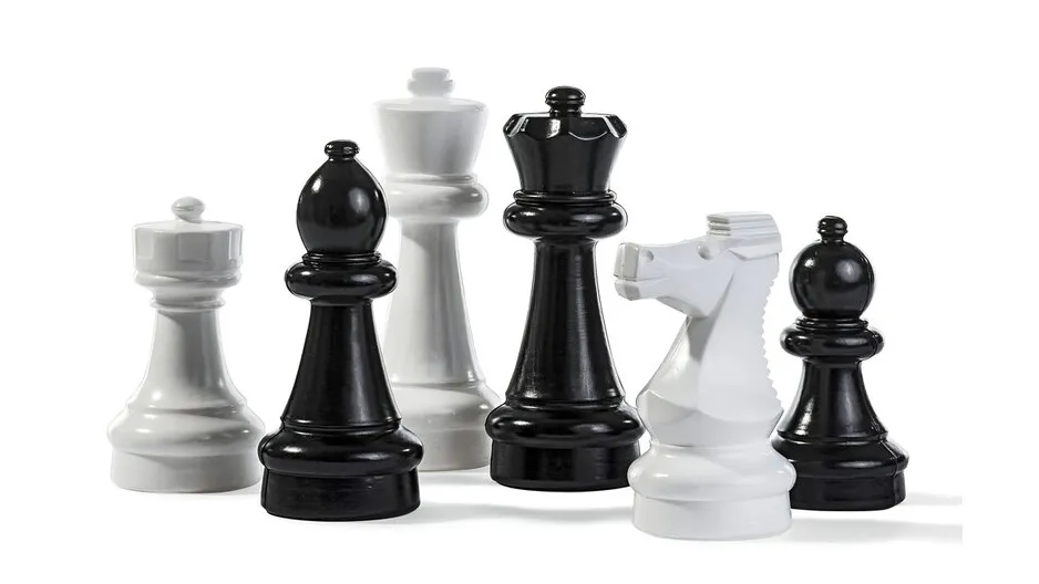 Giant chess pieces on a white background.
