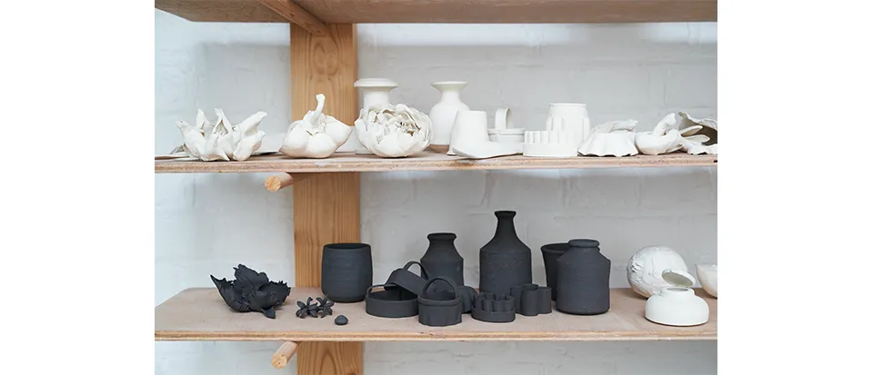 Before becoming interested in flowers, Kaori made objects such as clothing and, here, kitchen utensils in clay.