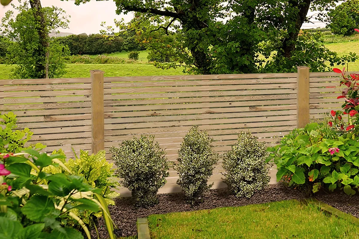 GoodHome Venetian Contemporary Pressure treated 3ft Wooden Fence panel (W)1.8m (H)0.9m in a garden