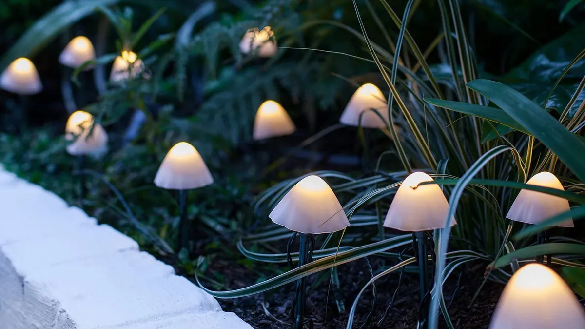 12 Mini Mushroom Solar Stake Lights in a garden border