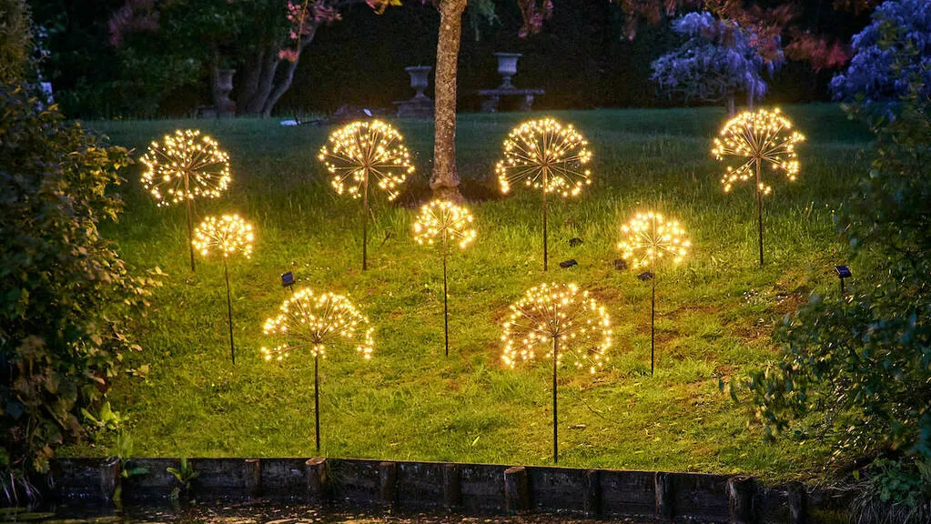 Dandelion Garden Solar Lights on a grassy bank