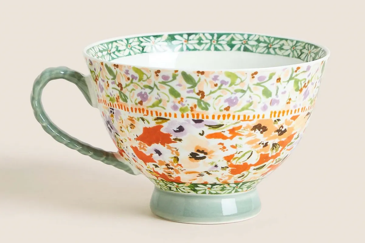 M&S Floral Footed Mug on a cream background