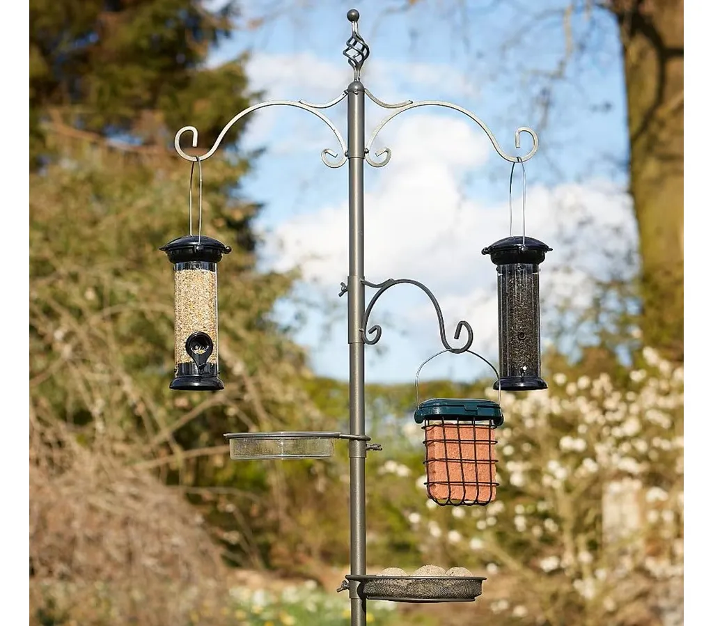 Pewter bird station in a garden