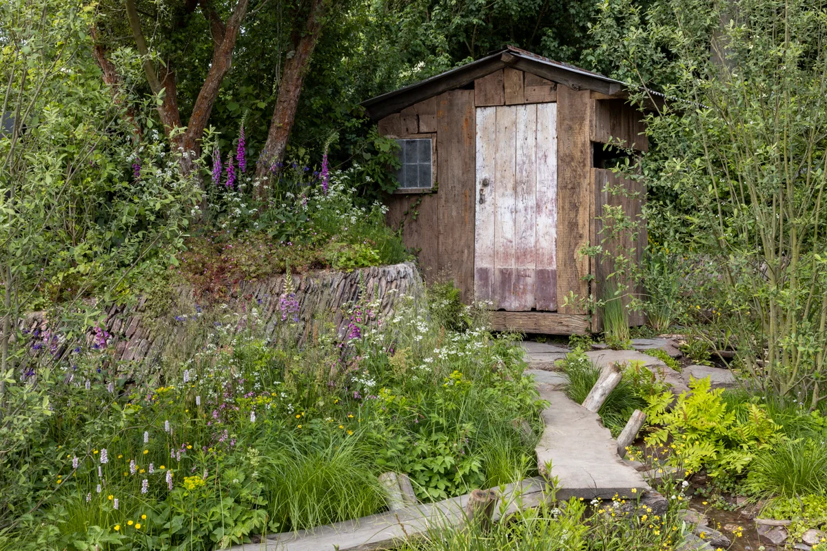 A Rewilding Britain Landscape. Designed by Lulu Urquhart and Adam Hunt. Sponsored by Project Giving Back in support of Rewilding Britain. Show Garden. RHS Chelsea Flower Show 2022. A Rewilding Britain Landscape winner of the Best Show Garden.