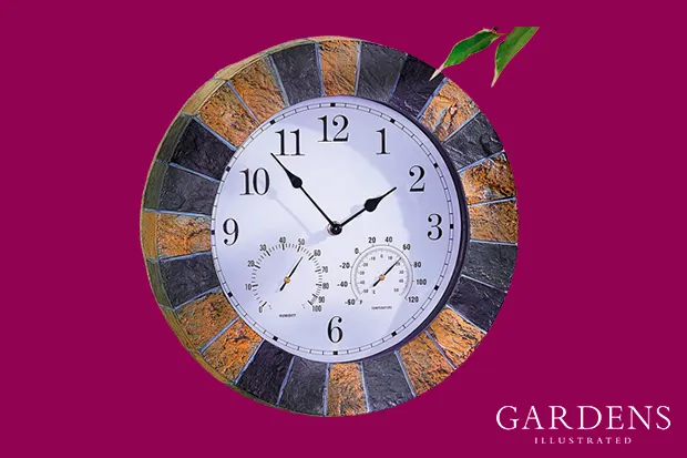 Garden clock in slate effect on a pink background