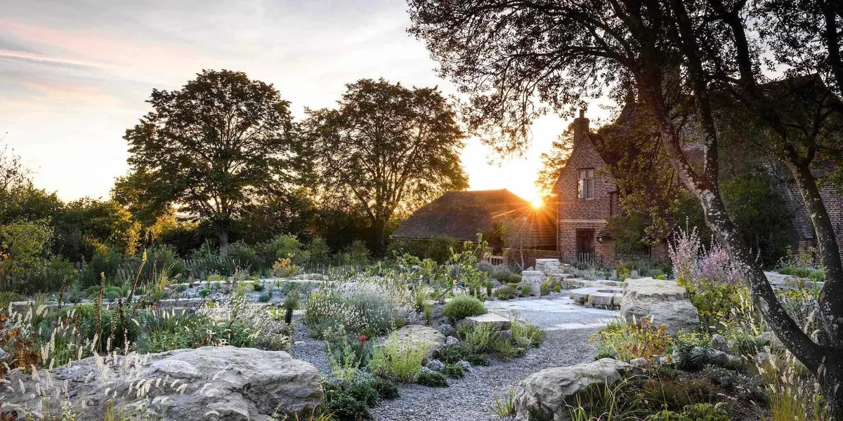 Sissinghurst’s Delos garden has been transformed into a Mediterranean-style space in line with the original vision. Grecian altars and a Mediterranean kermes oak are placed along the main walkway
