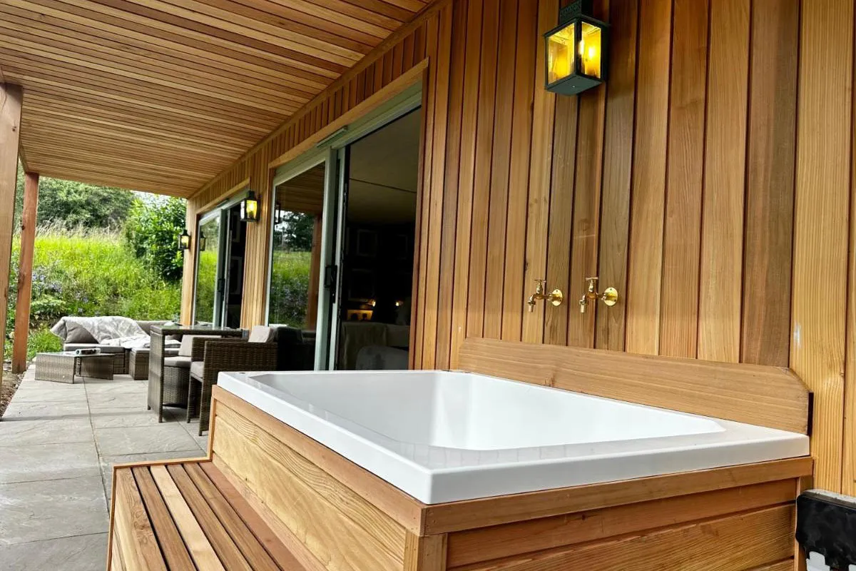 An outdoor bath on a terrace at Woodcutters Cabin, Peak District 